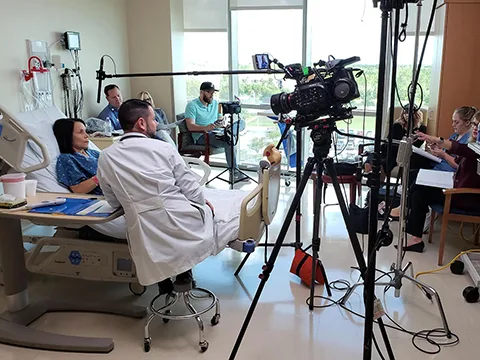 Medical researcher filmed in a laboratory for a healthcare video