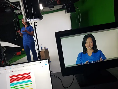 Clinician filmed with a patient during a healthcare production