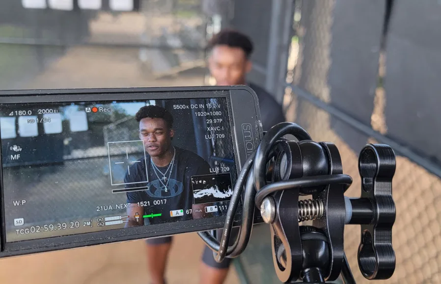 Student being interviewed on camera for a university film